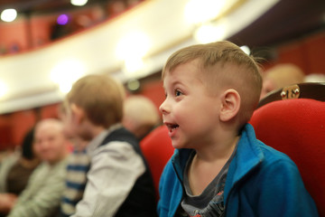 Smiling boy in theater