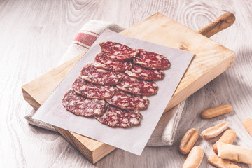 Traditional Iberian Spanish sausage on wooden board