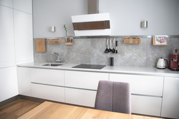 wooden table in the snow-white kitchen
