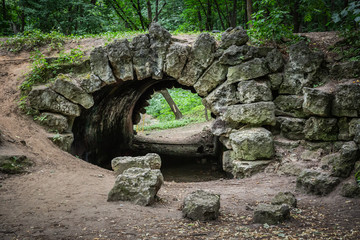 Fototapeta na wymiar Old stone bridge in the forest