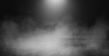 Background scene of empty street. Night view of the river, the night sky with clouds, the reflection of light on the water. Smoke fog