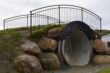 Bridge over the concrete pipe. Parks and recreation. Norway