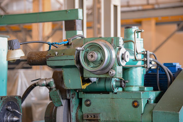 Grinding machine at a machine-building enterprise in a metalworking workshop.
