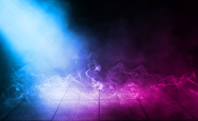 Background of empty street at night. Concrete paving slabs, illuminated by the light of multi-colored neon lamps. Fog, smoke