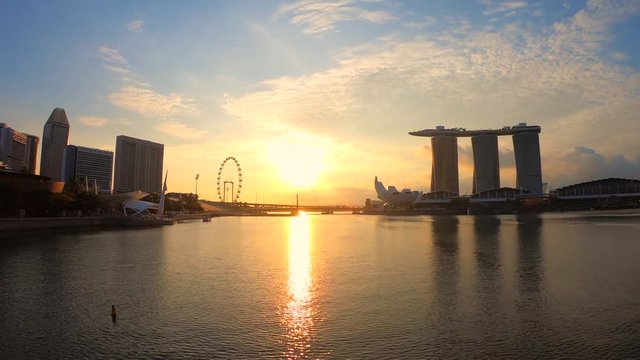 Beautiful time lapse of Singapore city skyline of Marina Bay on sunrise