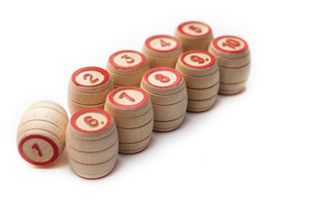 Bingo or lotto game. Wooden kegs of lotto on cards.