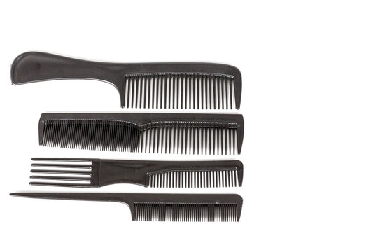 hair tools, beauty and hairdressing concept - different combs on white background