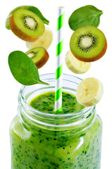 Spinach banana kiwi smoothie on a white background