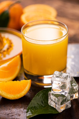 Orange juice with a rusitc setup.