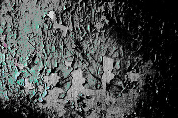Light gray wall with green flaking paint. Grunge vintage background
