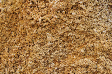 Rock, layeres structure, warm brown, yellow, red shades.