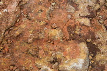  Rock, layeres structure, warm brown, yellow, red shades.