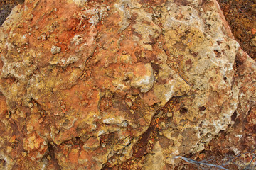  Rock, layeres structure, warm brown, yellow, red shades.