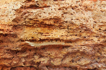  Rock, layeres structure, warm brown, yellow, red shades.