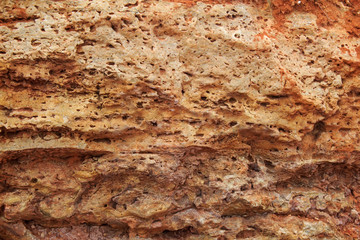  Rock, layeres structure, warm brown, yellow, red shades.