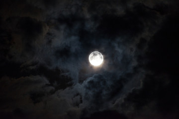 Fototapeta na wymiar Moon through the clouds at night, super moon