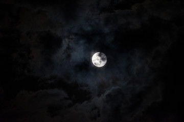 Naklejka na ściany i meble Moon through the clouds at night, super moon