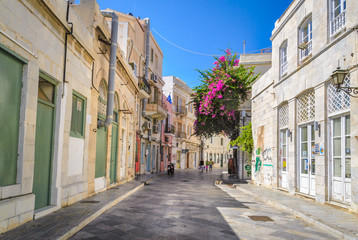 Fototapeta na wymiar Sidewalk with traditional neoclassical buildings in Ermoupoli in Syros island capital of Cyclades Greece