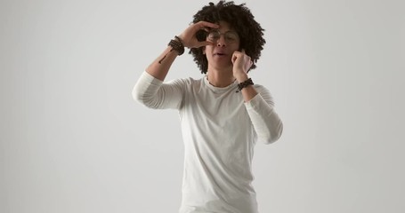 Surprised young man talking on mobile phone