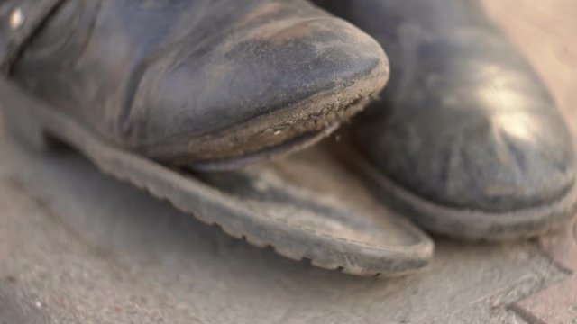 dirty torn old boots