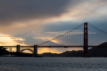 Clouds behind the Golden Gate Bridge at sunset.