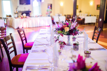 Beautiful table decoration with fresh flowers and accessoires