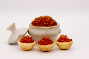 Luxury Red Caviar in the bowl. Food photo concept.
