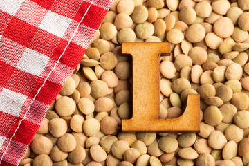 Letter L, Lentils with checkered napkin - Top view