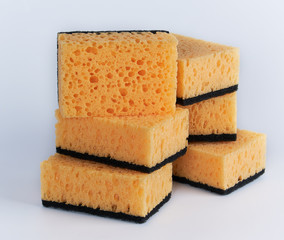 stack of yellow kitchen sponges for washing dishes