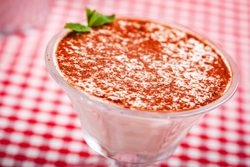 Tiramisu in portion glass. Close up