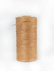 coiled brown rope on white background