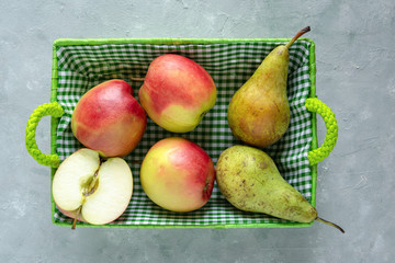 Fresh apples and pears in basket. Healthy fruits. Diet concept.