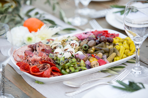 charcuterie plate of mixed meats, cheeses, and veggies