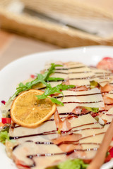 Concept for a tasty and healthy meal. Close-up fresh salad with fish 