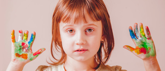 Colorful  painted hands of cutel little child girl. Art, childhood, color concept.