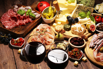 Italian antipasti wine snacks set. Cheese variety, Mediterranean olives, crudo, Prosciutto di...