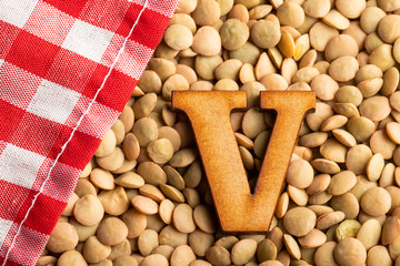 Letter V, Lentils with checkered napkin - Top view