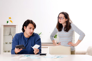 Young couple in budget planning concept 