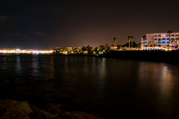 Obraz premium Cyprus, Paphos, night city panorama lights, coastline and sea