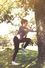 Active young woman exercise outdoor at summer time