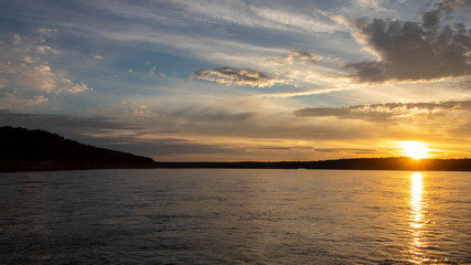 Obraz premium sunset over the river