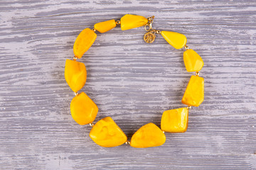 A necklace from amber of honey color