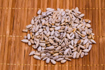 sunflower seeds on wooden background