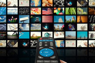 TV set with pictures of smart television and remote control,close up.