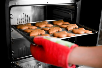 Cookies on a baking tray in the oven close up