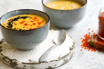 Lentil soup with paprika, sesame and pumpkin seeds
