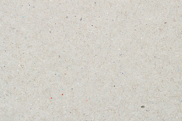 Texture of organic light craft paper, background for design with copy space text or image. Recyclable material, has small inclusions of cellulose