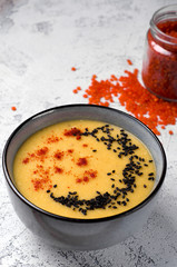Lentil soup with paprika, sesame and pumpkin seeds