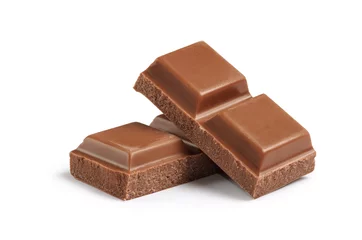 Cubes of milk chocolate bar isolated on white background © GarkushaArt