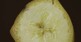 Rotate of banana piece on a dark background